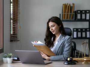Asian lawyer woman working with a laptop computer in a law office. Legal and legal service concept.